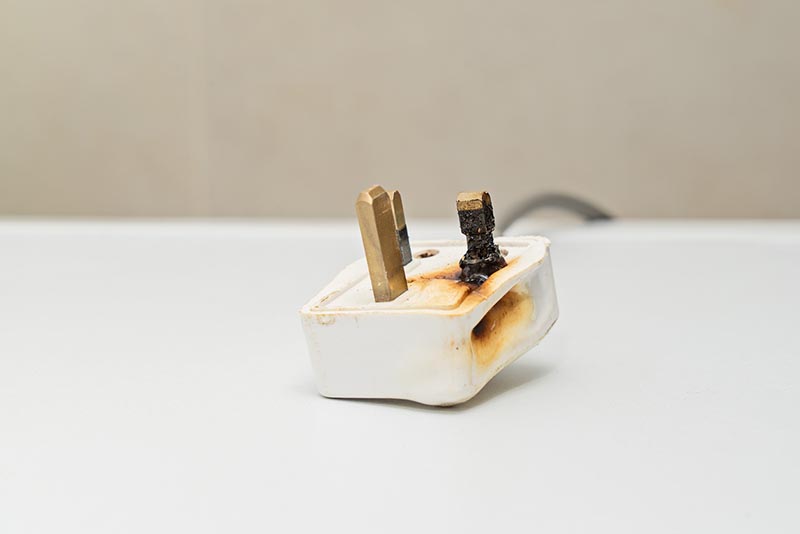 A burnt plug requiring a claim to product liability insurance.